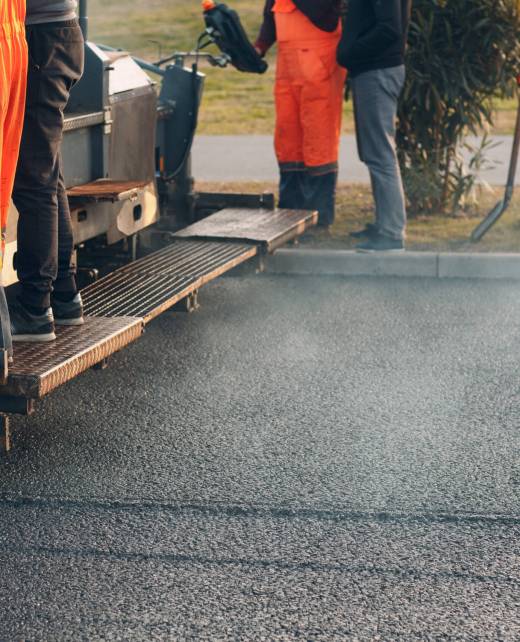 Asphalt paving. Paver machine and workers. New road construction.