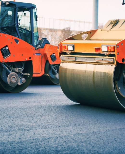 road-roller-working-on-the-new-road-construction-s-2023-11-27-05-34-02-utc